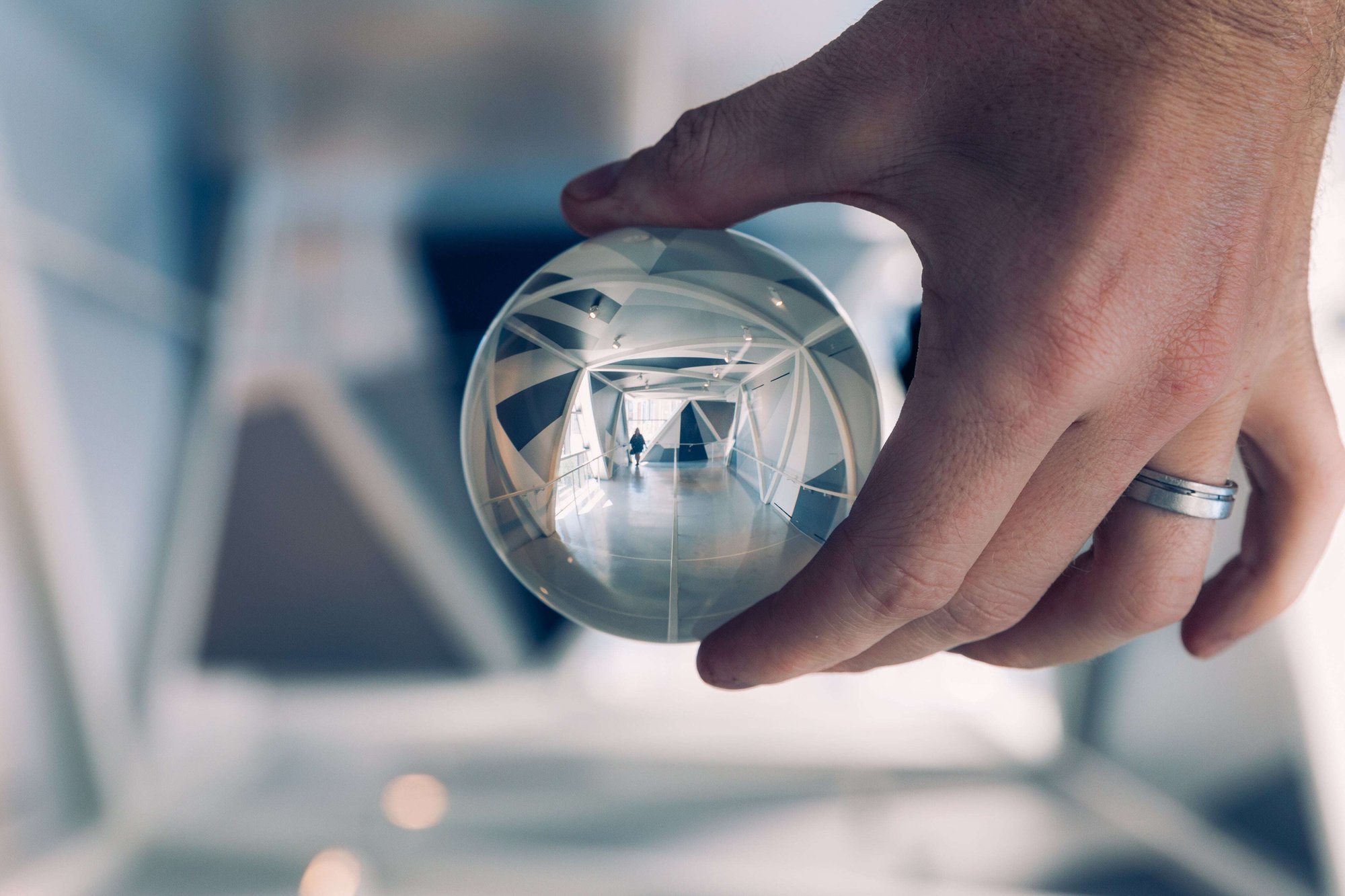 lensball-person-walking-down-hallway